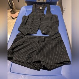Guess Black Vest and Shorts Ensemble. The Shorts are 28 Waist And The Vest Large